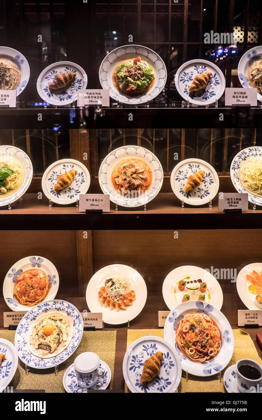 Food made of plastic in a shopwindow of a restaurant Stock Photo
