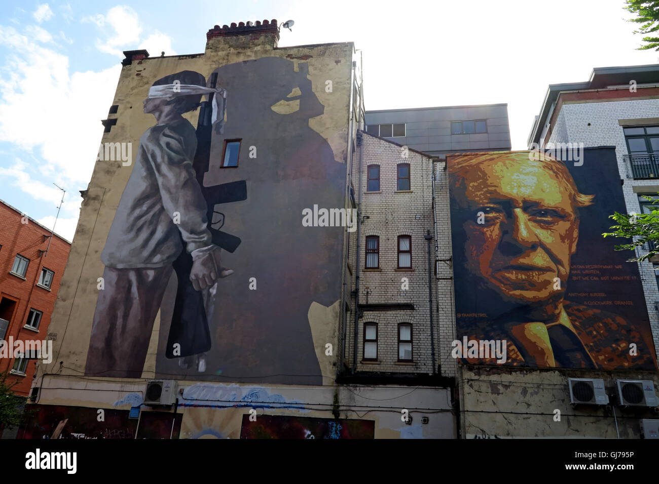 Author Anthony Burgess mural art work, with blindfolded child holding gun, Northern Quarter, Brightwell walk, Manchester M4 5JD Stock Photo