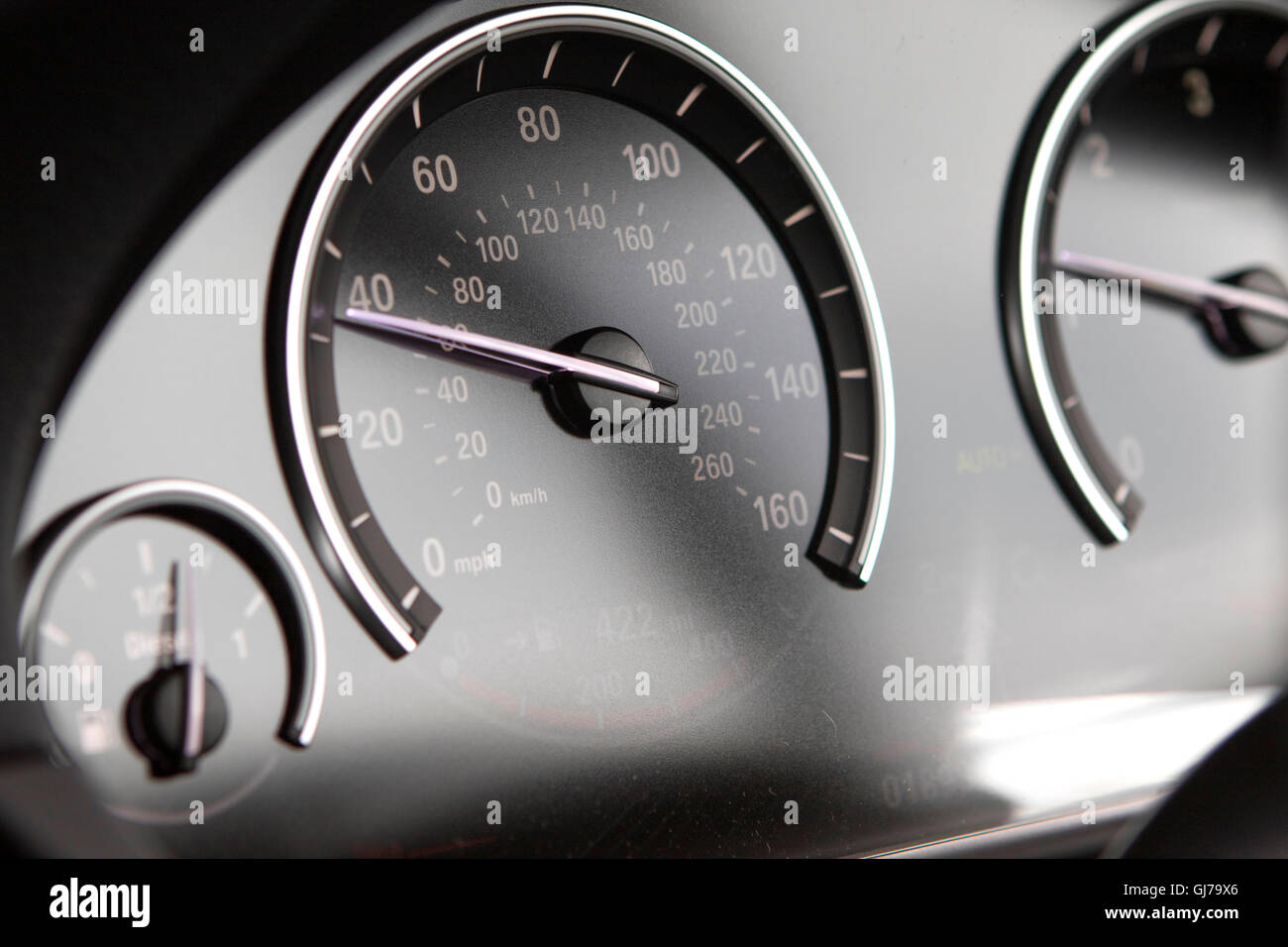 Close up interior detail speedometer dashboard of a F10 BMW 5 Series sedan saloon Stock Photo