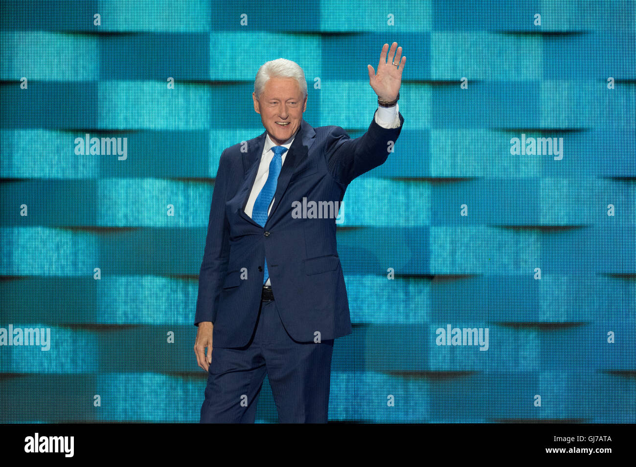 Former President Bill Clinton walks on stage for his keynote address at the 2nd day of the Democratic National Convention at the Wells Fargo Center July 26, 2016 in Philadelphia, Pennsylvania. Stock Photo