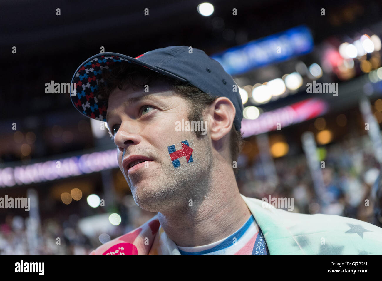 A Hillary Rodham Clinton supporter during the roll call vote during the 2nd day of the Democratic National Convention at the Wells Fargo Center July 26, 2016 in Philadelphia, Pennsylvania. Stock Photo