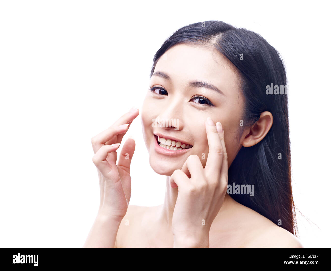 young and beautiful asian woman with clean, fresh and smooth skin, isolated on white background. Stock Photo