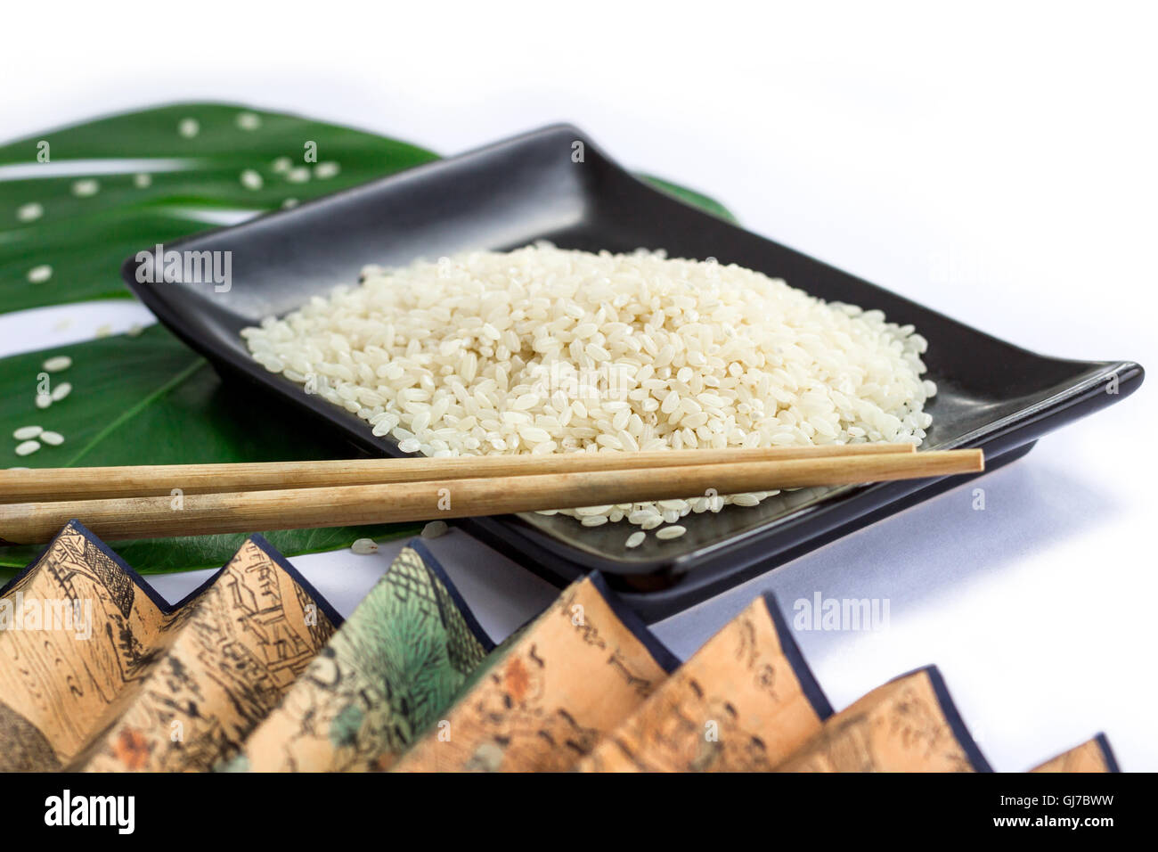 Oriental set of rice, chopsticks, green leaf and transp Stock Photo