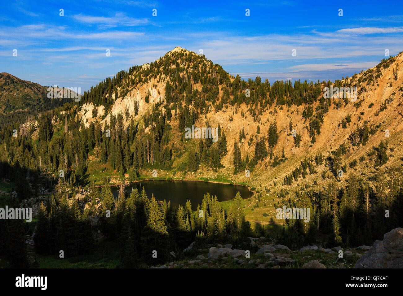 This is a lateafternoon view of Lake Catherine and Pioneer Peak as