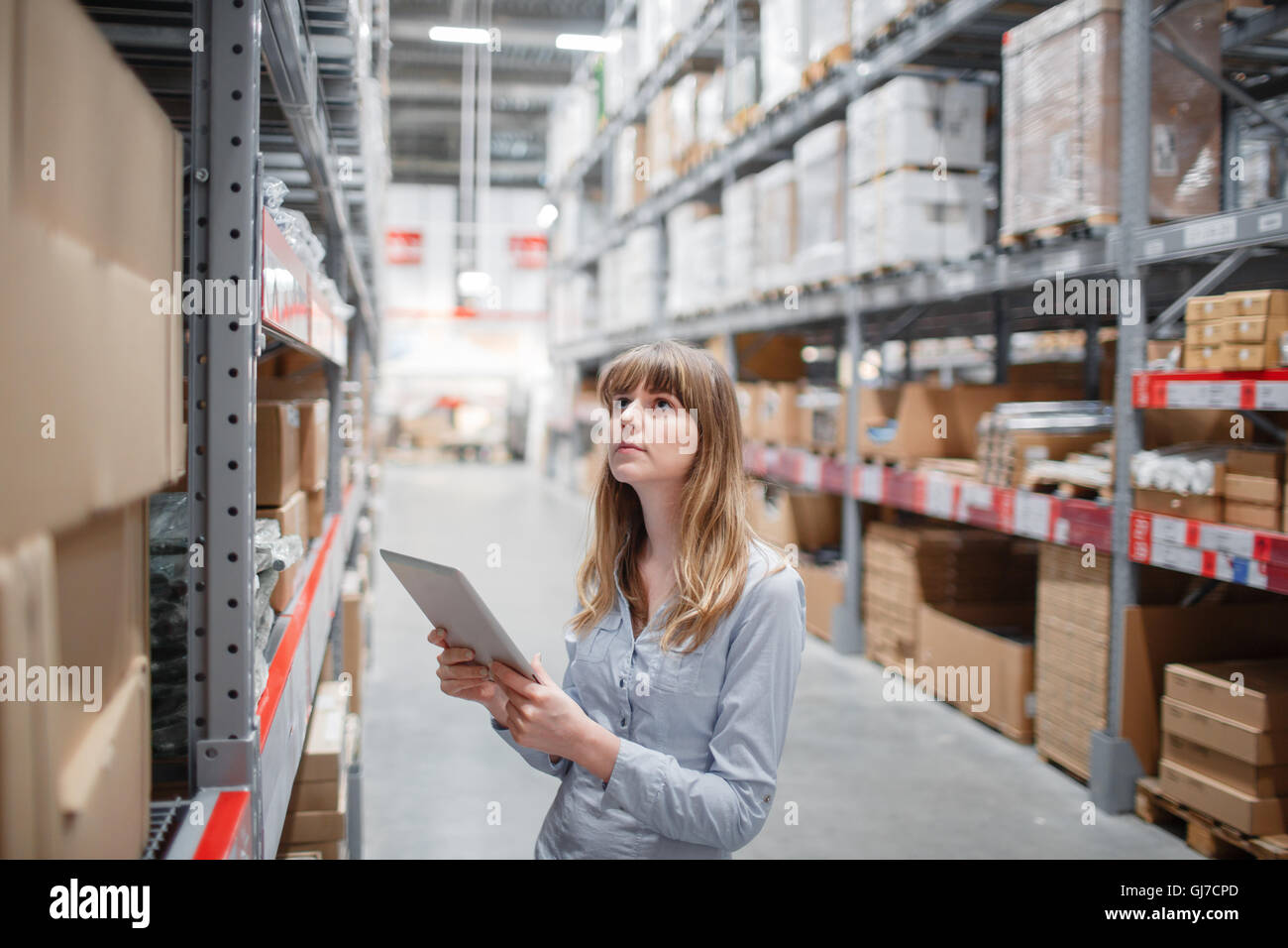 beautiful young furniture store worker stock taking Stock Photo Alamy