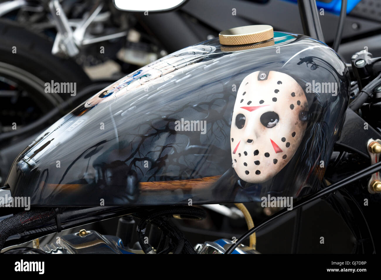 Harley Davidson Motorbike Tank spray painted with Jason Voorhees from Friday the 13th Stock Photo