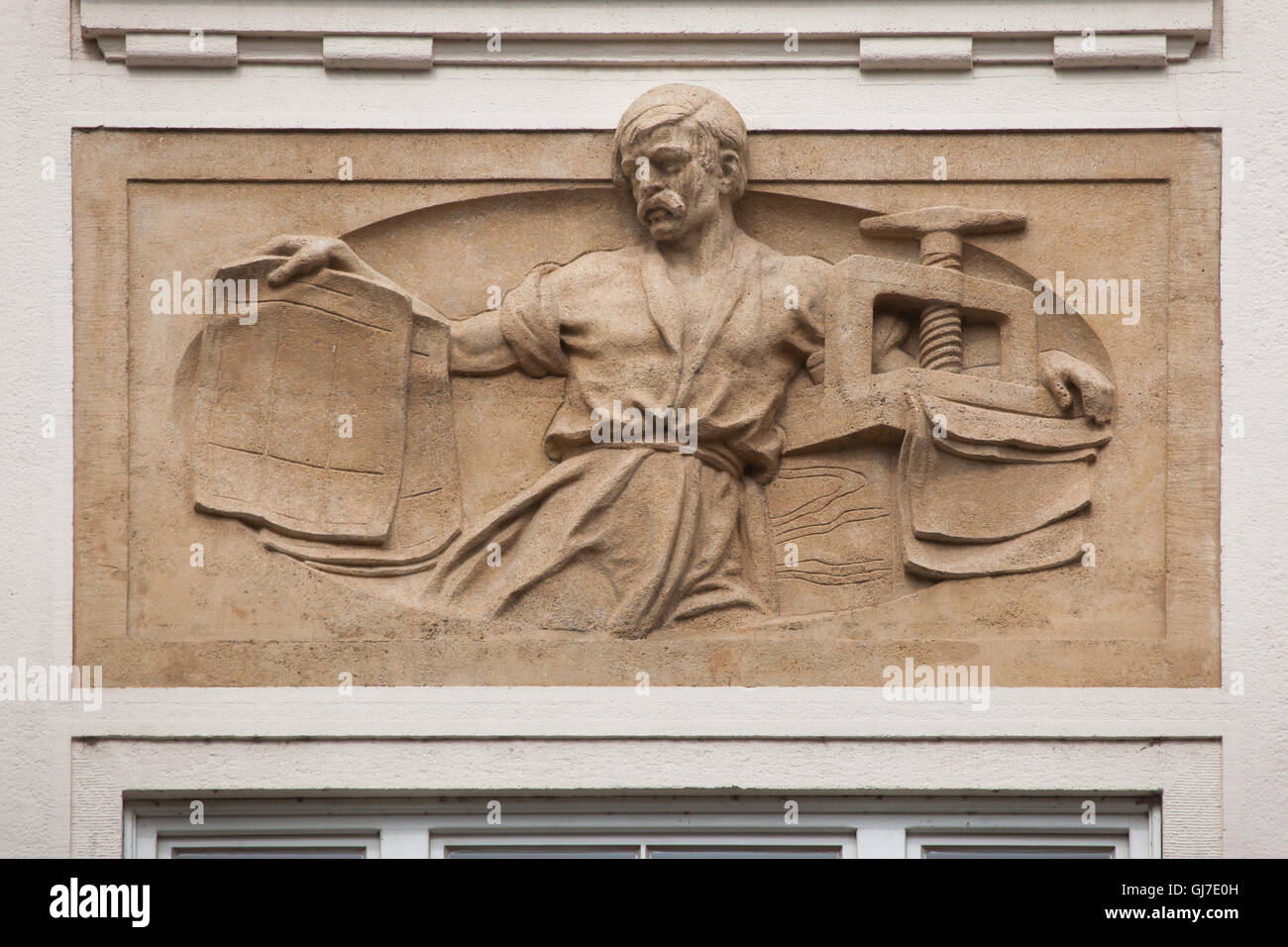 Printer working on the printing press depicted the Art Nouveau revenue house in Wenceslas Square in Prague, Czech Republic. Stock Photo