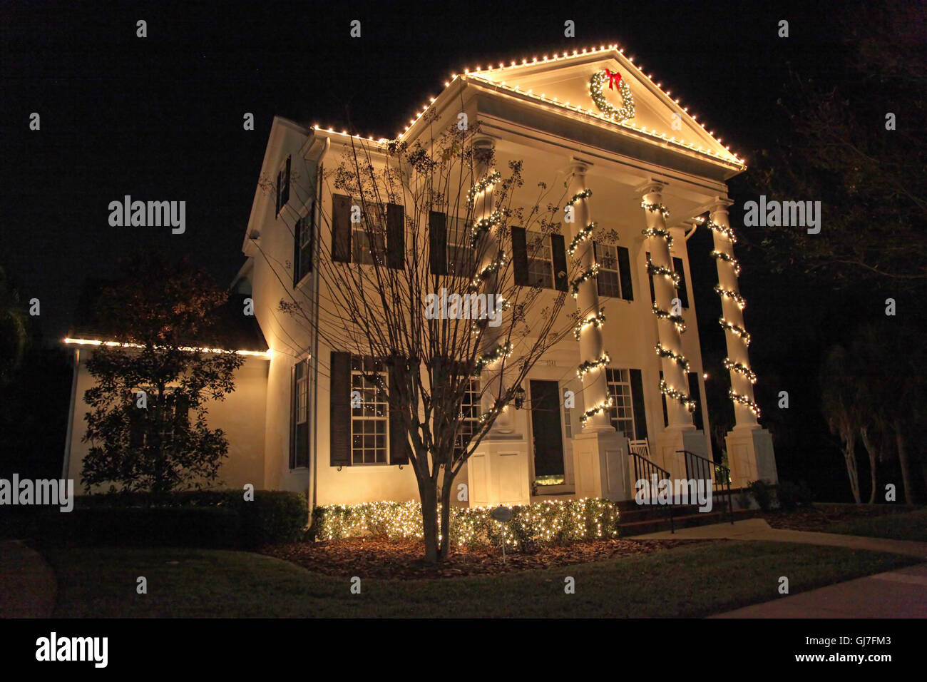 A Colonial House with a lot of Christmas Lights Stock Photo Alamy