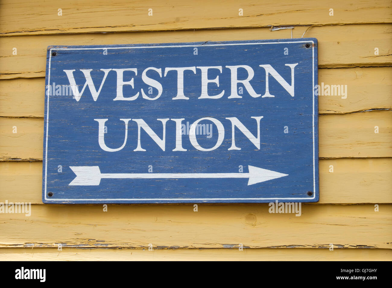 Western Union sign on side of restored railroad building in Bertram Texas Stock Photo