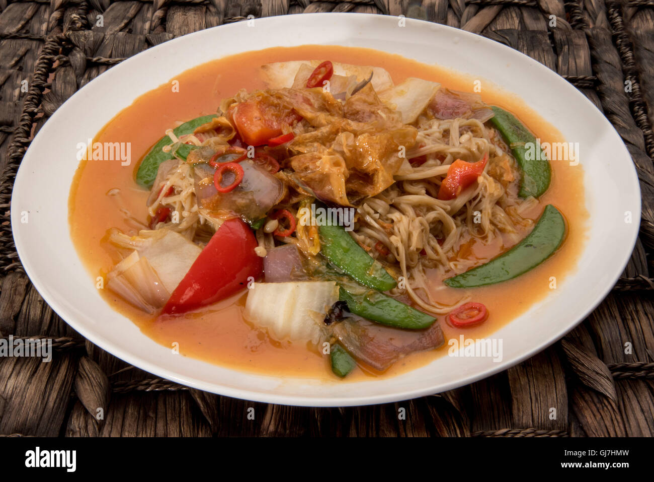vegetarian dish stir fried enoki mushrooms with other vegetables Stock