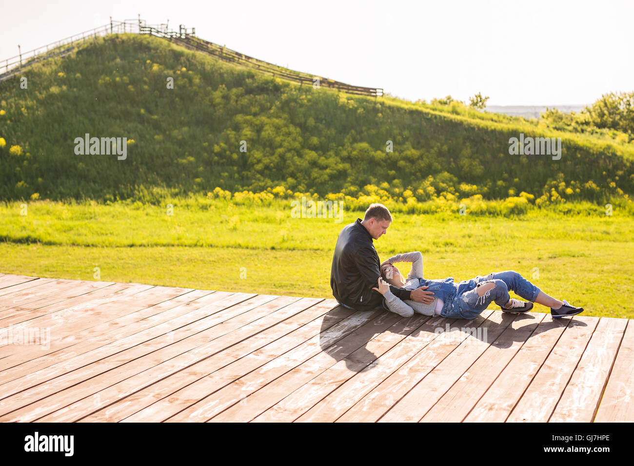 Happy pregnant woman and her husband in the park Stock Photo - Alamy