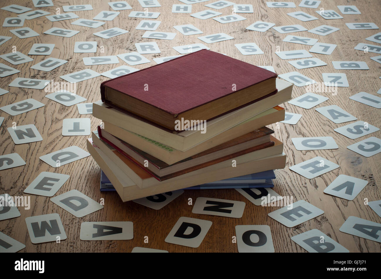 Old closed books in a letter cards background Stock Photo