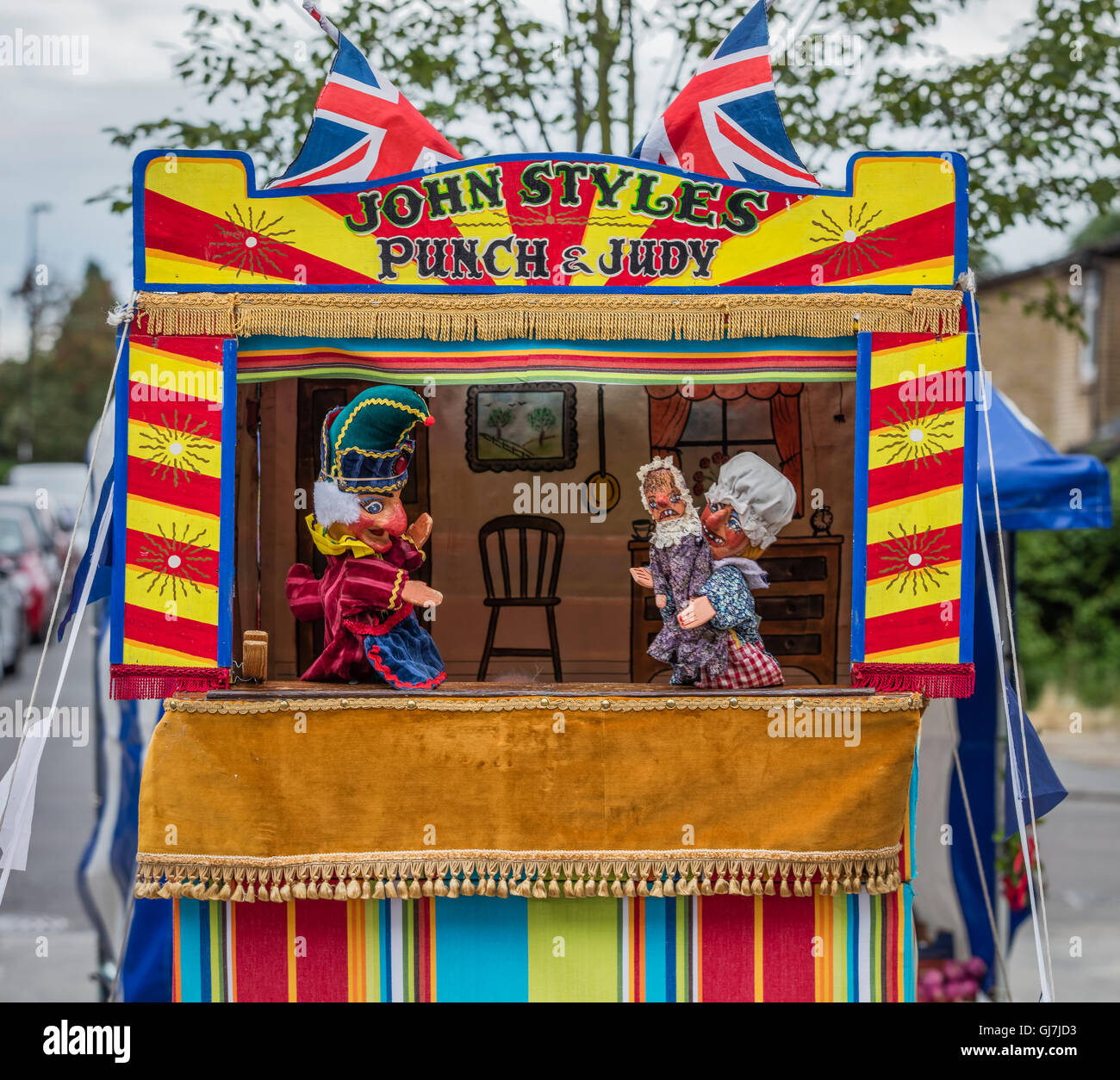 Mr Punch with Judy and the baby in a Punch and Judy booth Stock Photo Alamy