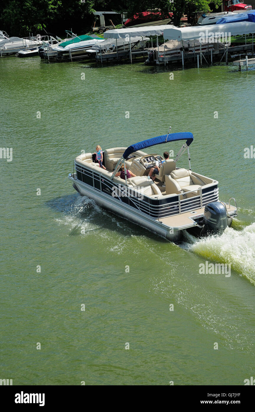 Pleasurecraft pontoon boat cruising the Fox River in Northern Illinois