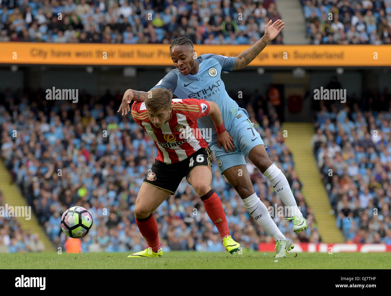 Sunderland's Lynden Gooch (left) and Manchester City's Raheem Sterling battle for the ball during the Premier League match at the Etihad Stadiium, Manchester. Stock Photo