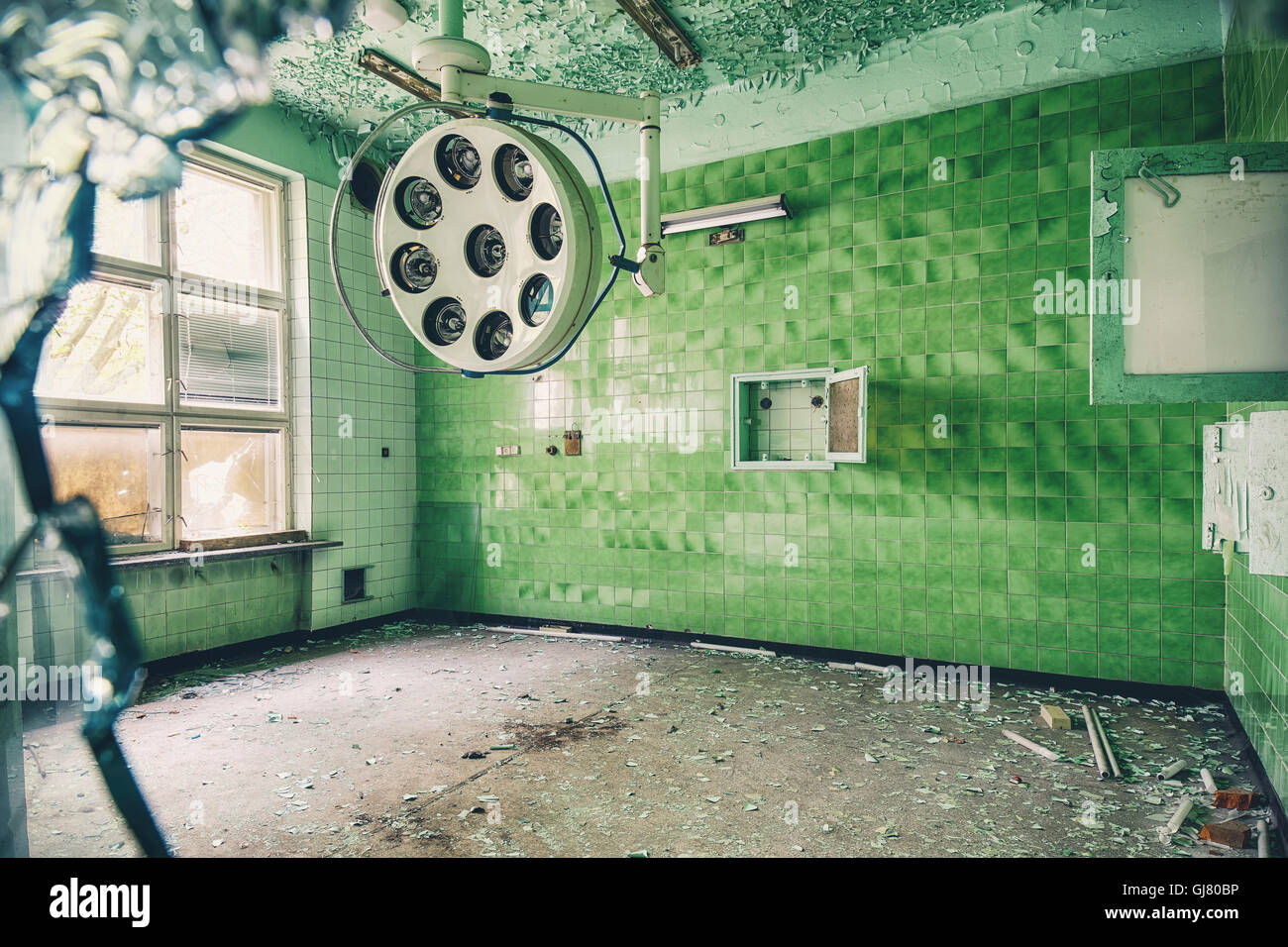 operating room in a former hospital with lamp in green Stock Photo Alamy