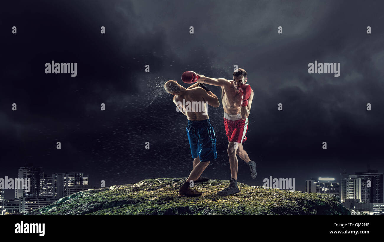 Box fighters trainning outdoor . Mixed media Stock Photo