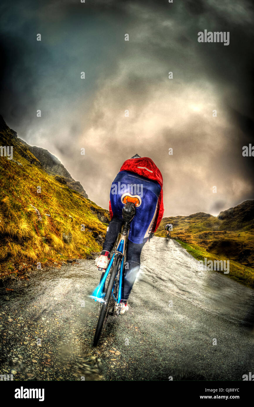 Rider in the Fred Whitton Challenge cycling Hardknott Pass, Cumbria, UK. Stock Photo