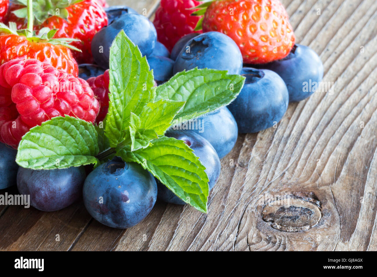 close-up of berries on a wooden background Stock Photo