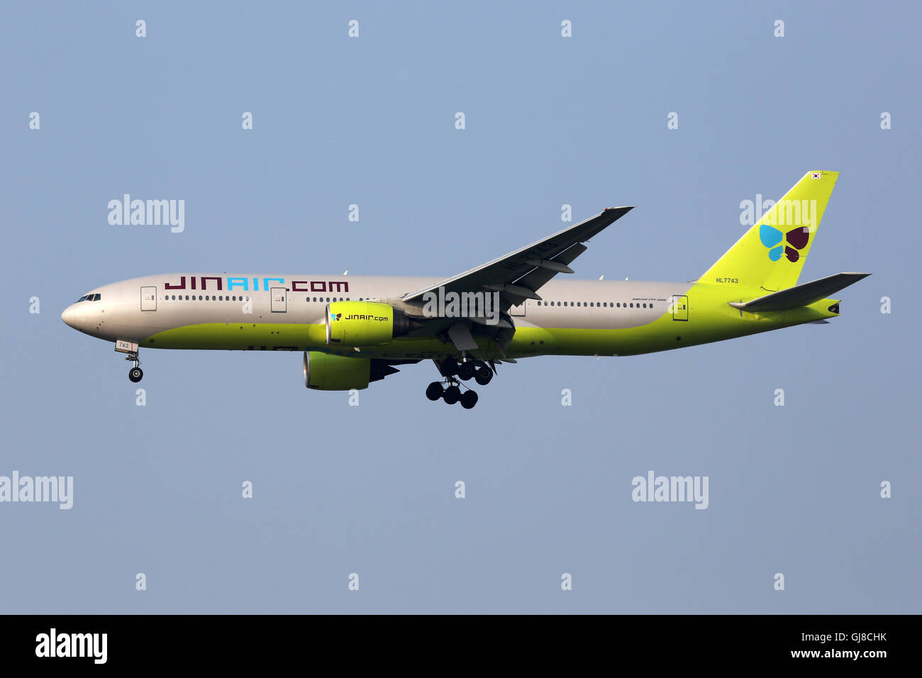 Incheon, South Korea - May 24, 2016: A Jin Air Boeing 777-200 airplane with the registration HL7743 approaching Seoul Incheon In Stock Photo