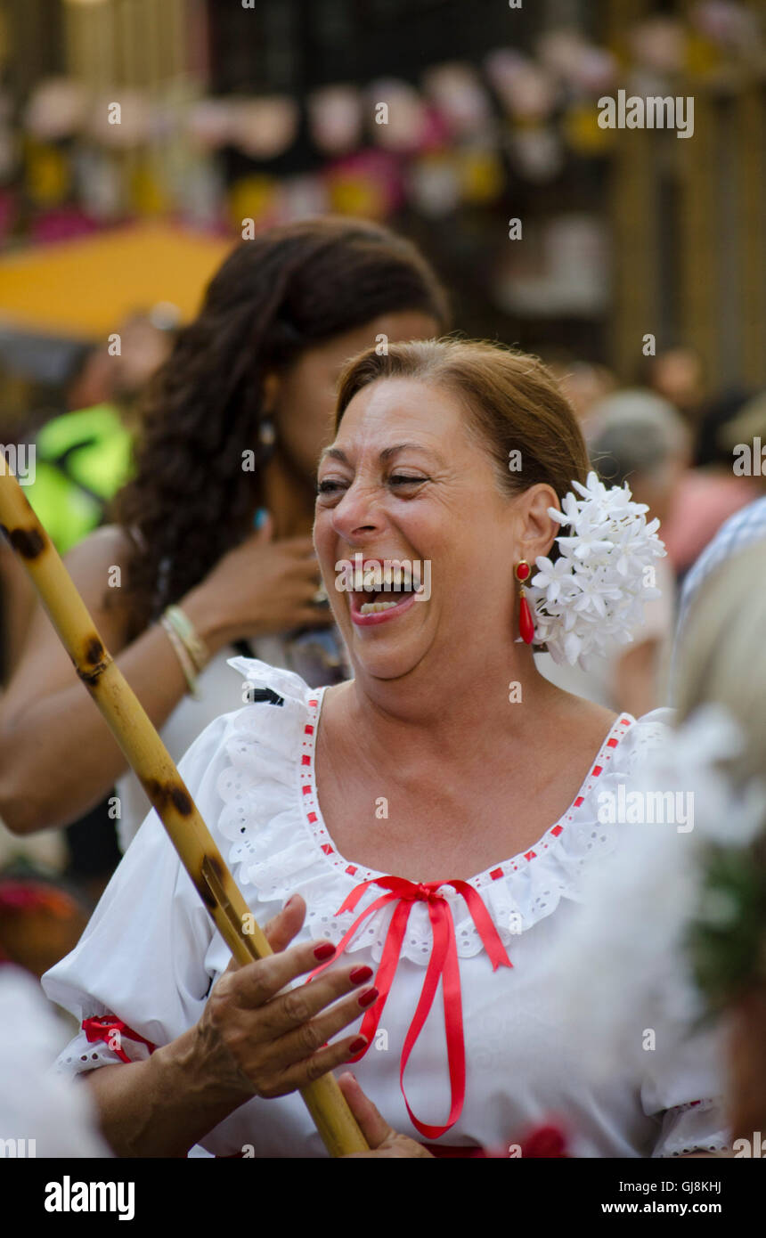 Malaga, Andalusia, Spain. 13th Aug, 2016. Woman laughing at start of Annual Feria of Malaga, Southern Spain's biggest summer fair starts. The feria celebrations. Credit:  Perry van Munster/Alamy Live News Stock Photo