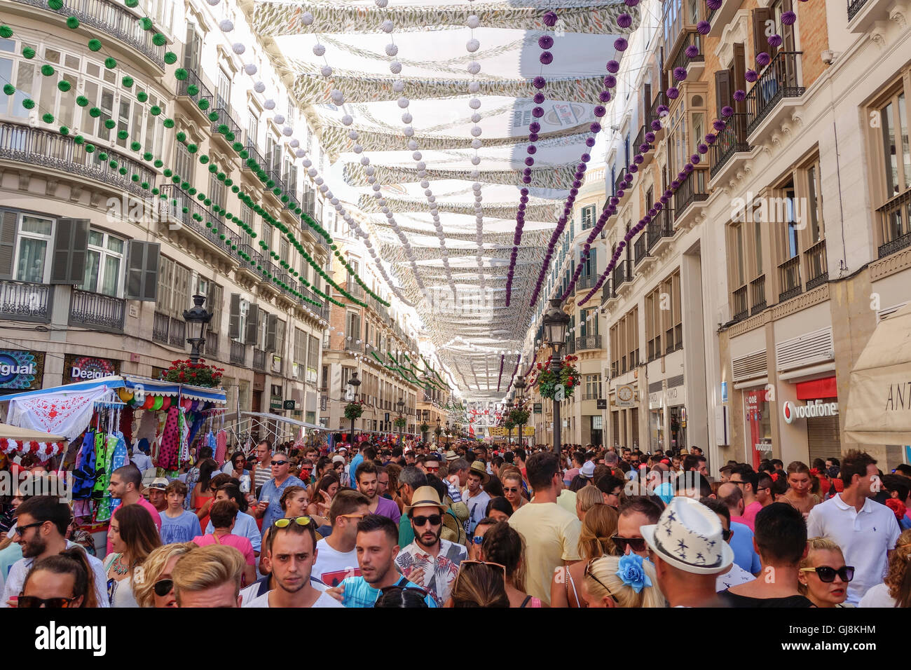 Malaga, Andalusia, Spain. 13th Aug, 2016. Crowd at Calle Larios, main street, celebrating start of Annual Feria of Malaga, Southern Spain's biggest summer fair starts. The feria celebrations. Credit:  Perry van Munster/Alamy Live News Stock Photo