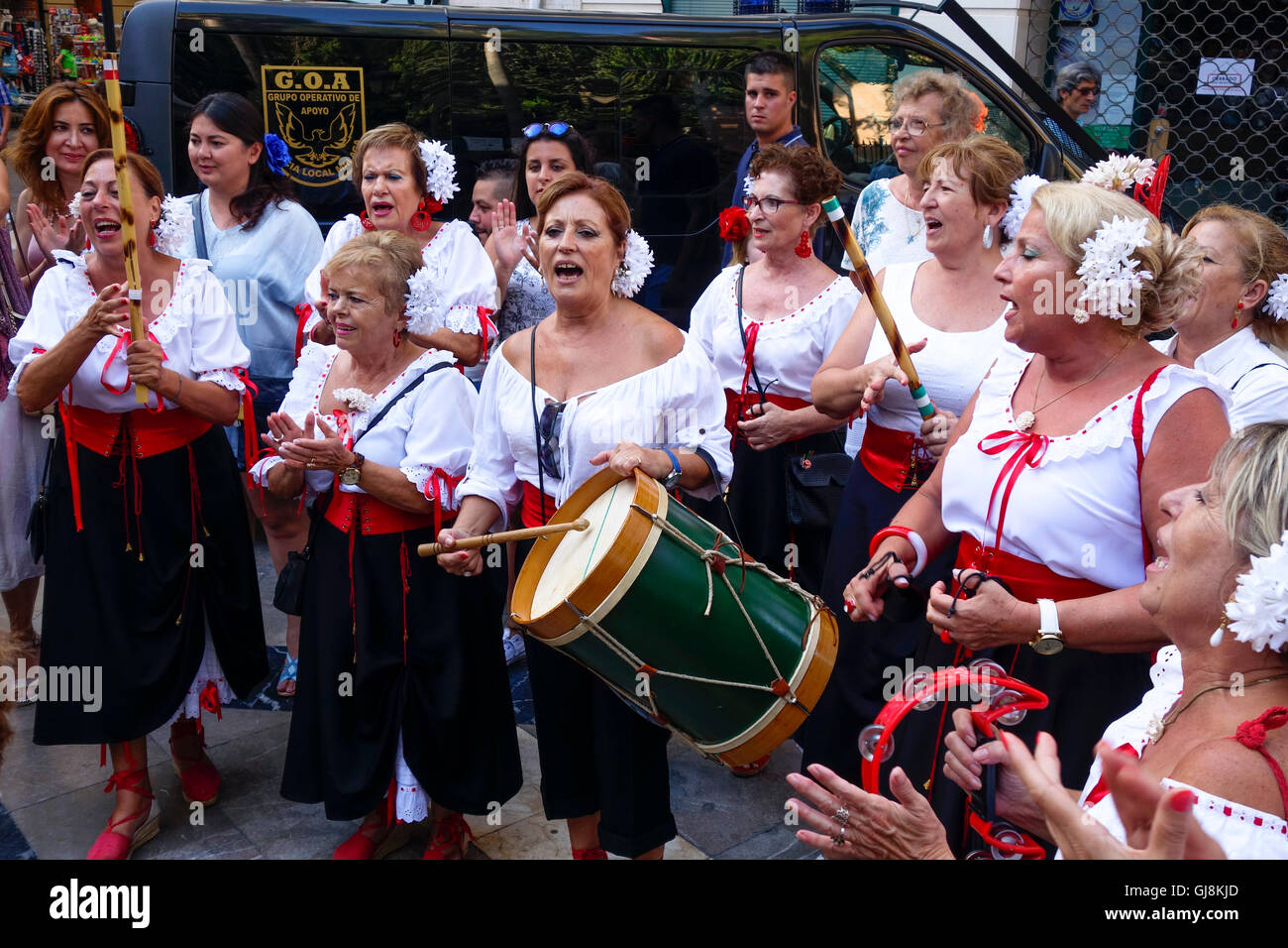 Malaga, Andalusia, Spain. 13th Aug, 2016. Traditional Verdiales. Group of elderly women singing, during start of Annual Feria of Malaga, Southern Spain's biggest summer fair starts. The feria celebrations. Credit:  Perry van Munster/Alamy Live News Stock Photo