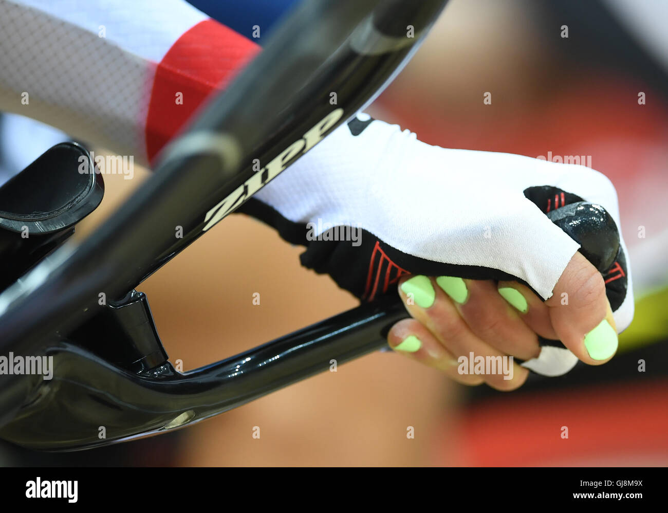 Rio de Janeiro, Brazil. 13th Aug, 2016. One member of team of Canada has her fingernails painted in lime green during the bronze medal race of the Women's Team Pursuit Final of the Rio 2016 Olympic Games Track Cycling events at Velodrome in Rio de Janeiro, Brazil, 13 August 2016. Photo: Felix Kaestle/dpa/Alamy Live News Stock Photo