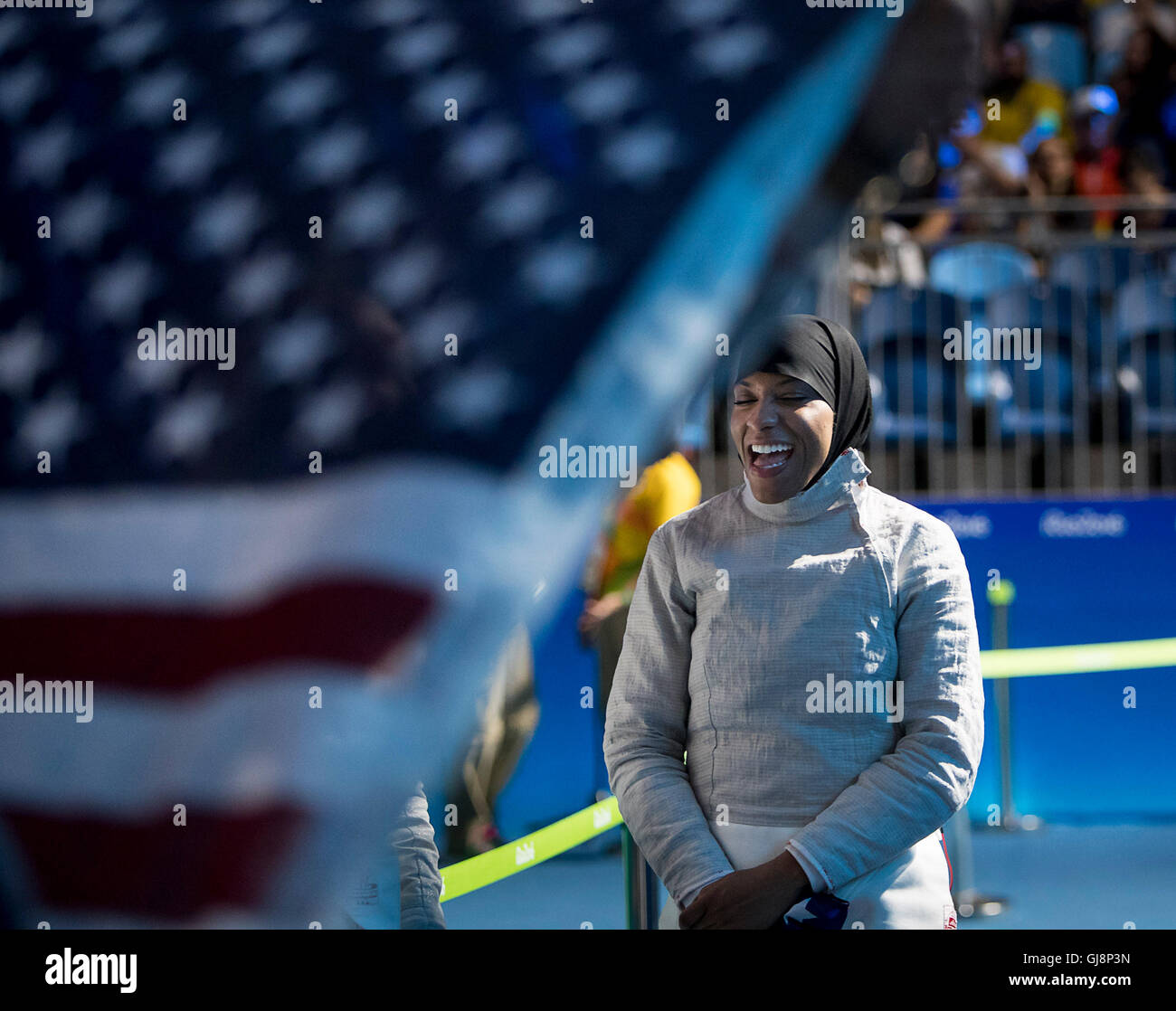 Rio de Janeiro, RJ, Brazil. 13th Aug, 2016. OLYMPICS FENCING: IBTIHAJ MUHAMMAD of the (USA) celebrates winning the bronze medal in the Woman's Sabre Team Fencing at Carioca Arena during the 2016 Rio Summer Olympics games. Credit:  Paul Kitagaki Jr./ZUMA Wire/Alamy Live News Stock Photo