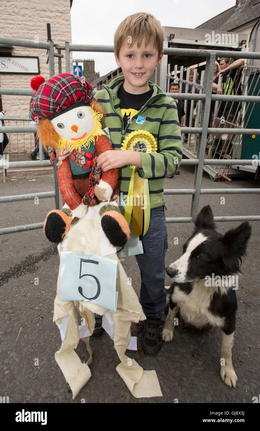 Moffat, Scotland. 14th August, 2016. Moffat sheep racing 2016: Callum Horn with sheep jockey no 5 Alfred's Alberto and Miss the dog Credit:  South West Images Scotland/Alamy Live News Stock Photo