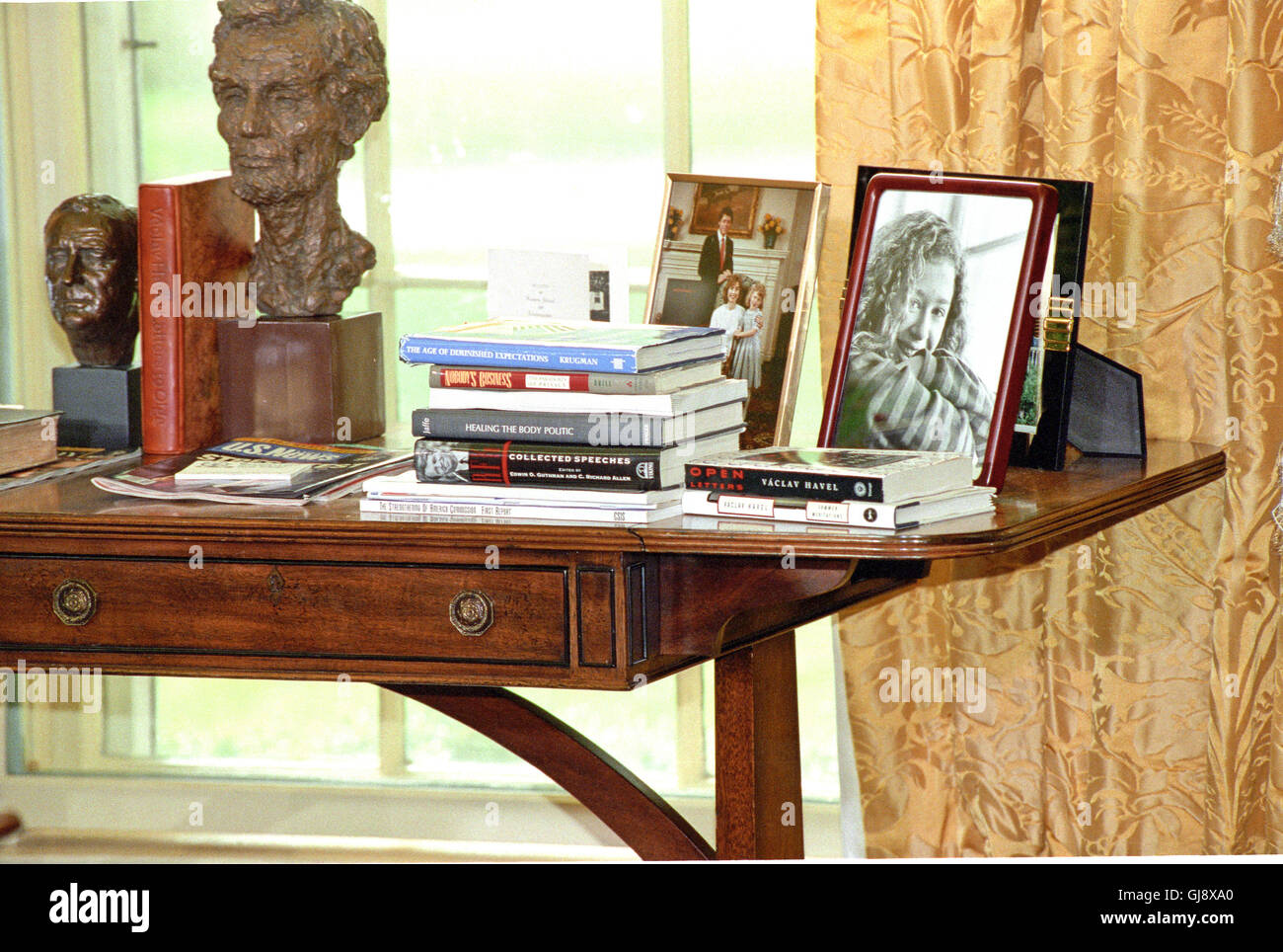 Books And Photos On The Credenza Behind The Desk As United States