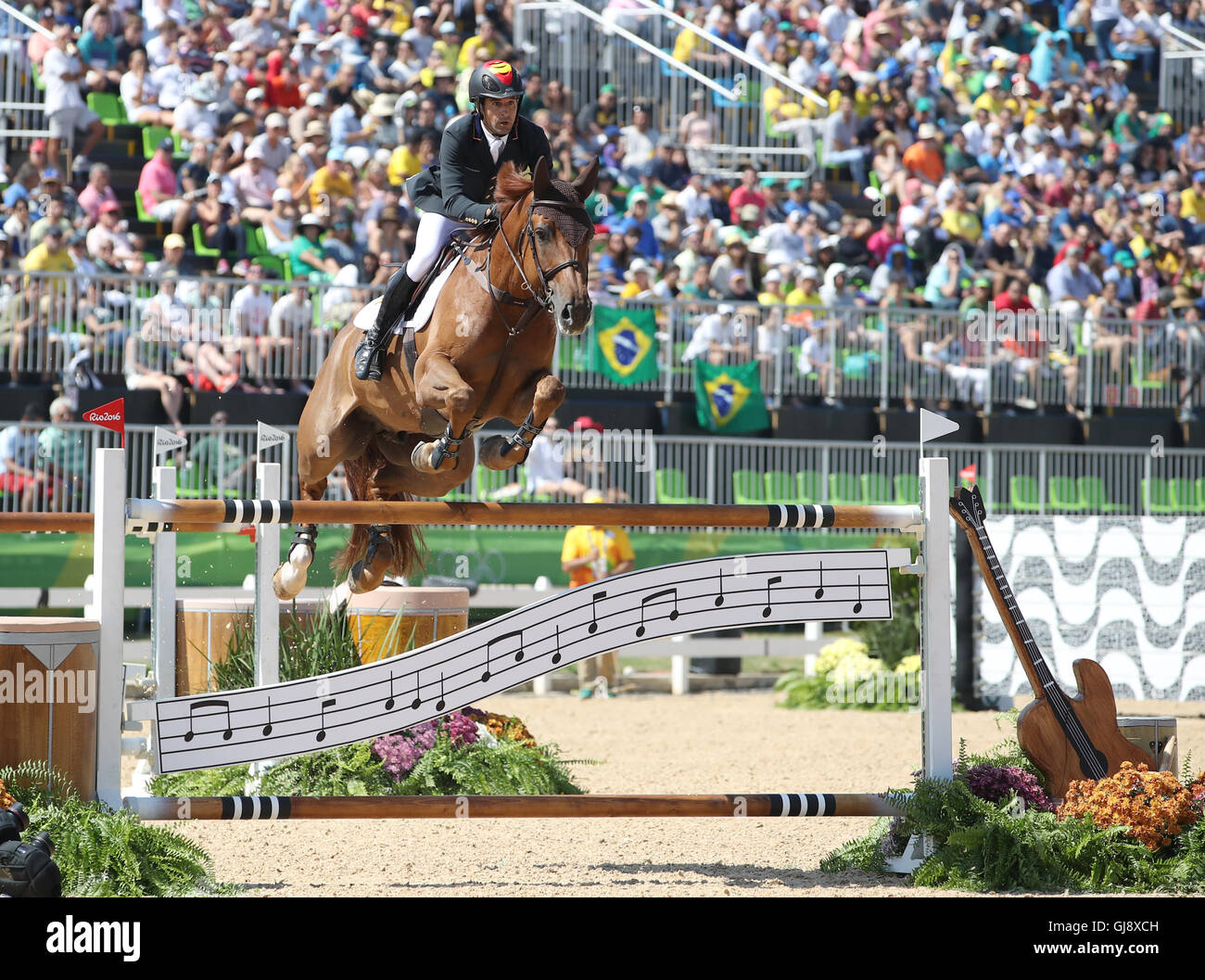 Rio de Janeiro, Brazil. 14th Aug, 2016. Manuel Fernandez Saro of Spain on horse U Watch clears an obstacle during the Jumping Team 1st Qualifier of the Equestrian competition at the Olympic Equestrian Centre during the Rio 2016 Olympic Games in Rio de Janeiro, Brazil, 14 August 2016. Photo: Friso Gentsch/dpa/Alamy Live News Stock Photo
