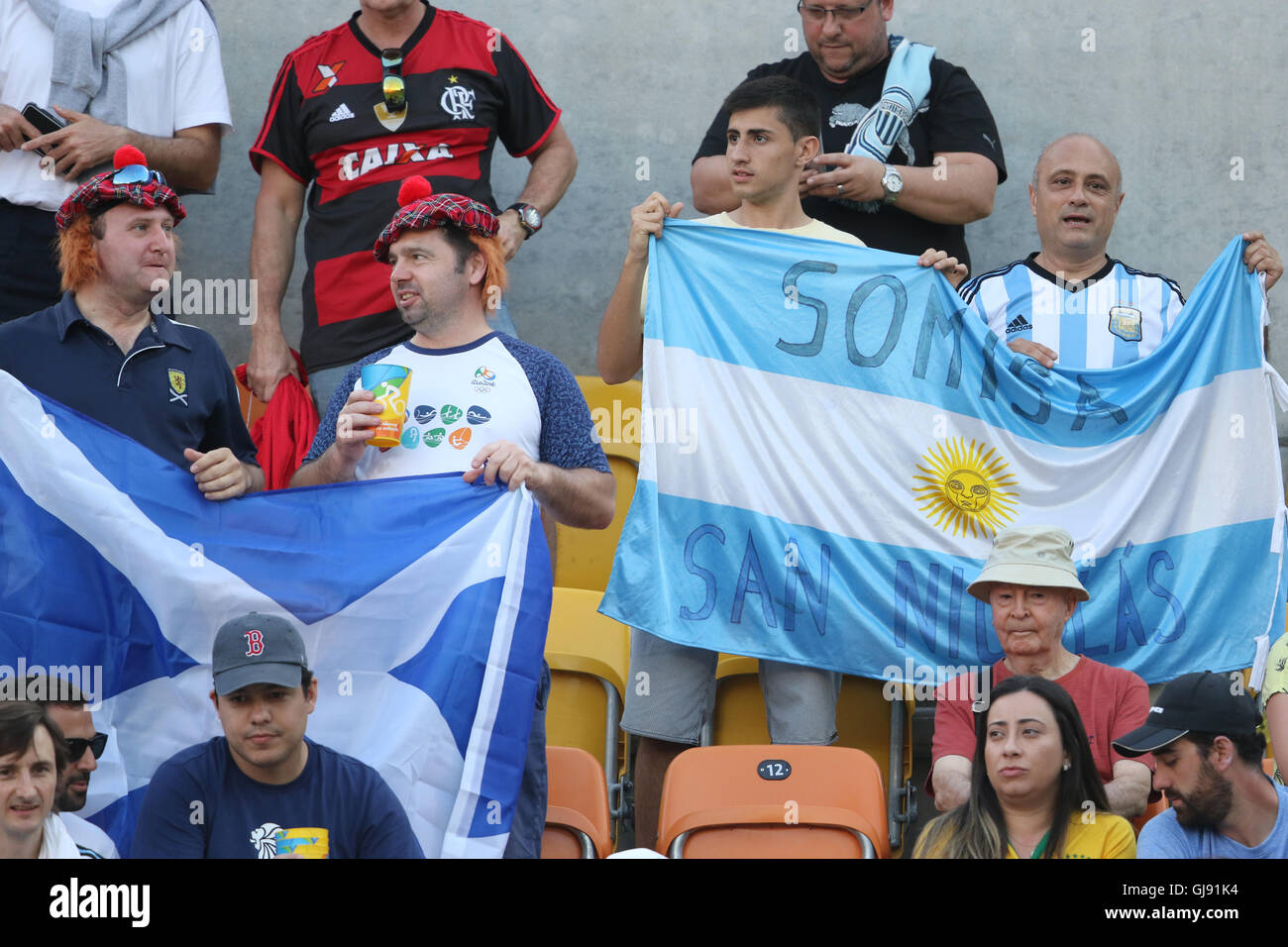 Rio de Janeiro, Brazil. 14th Aug, 2016. The Scottish Saltire flag and the Argentinian flag being waved side by side at the Murray v del Potro Mens Singles Olympic Tennis Final in Rio de Janeiro, Brazil Credit:  PictureScotland/Alamy Live News Stock Photo