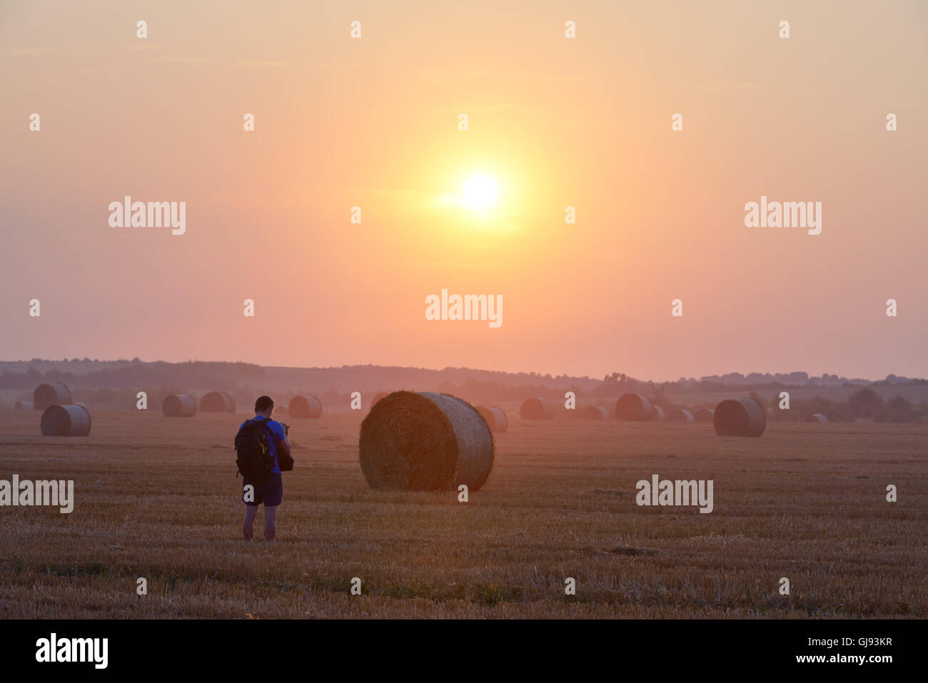 Amazing rural scene on autumn field with straw roles Stock Photo