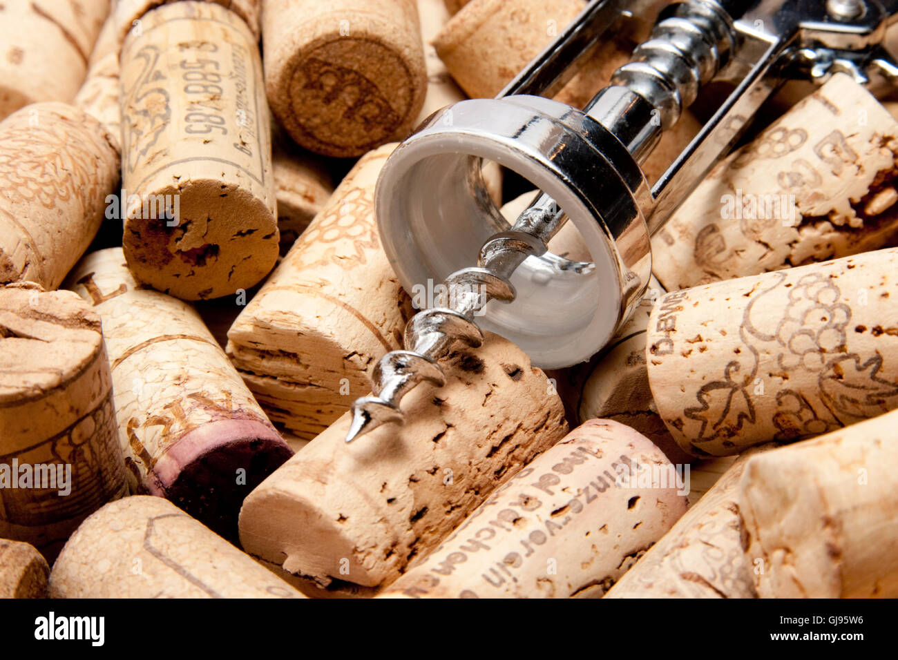 pile of cork of a wine bottle with corkscrew Stock Photo