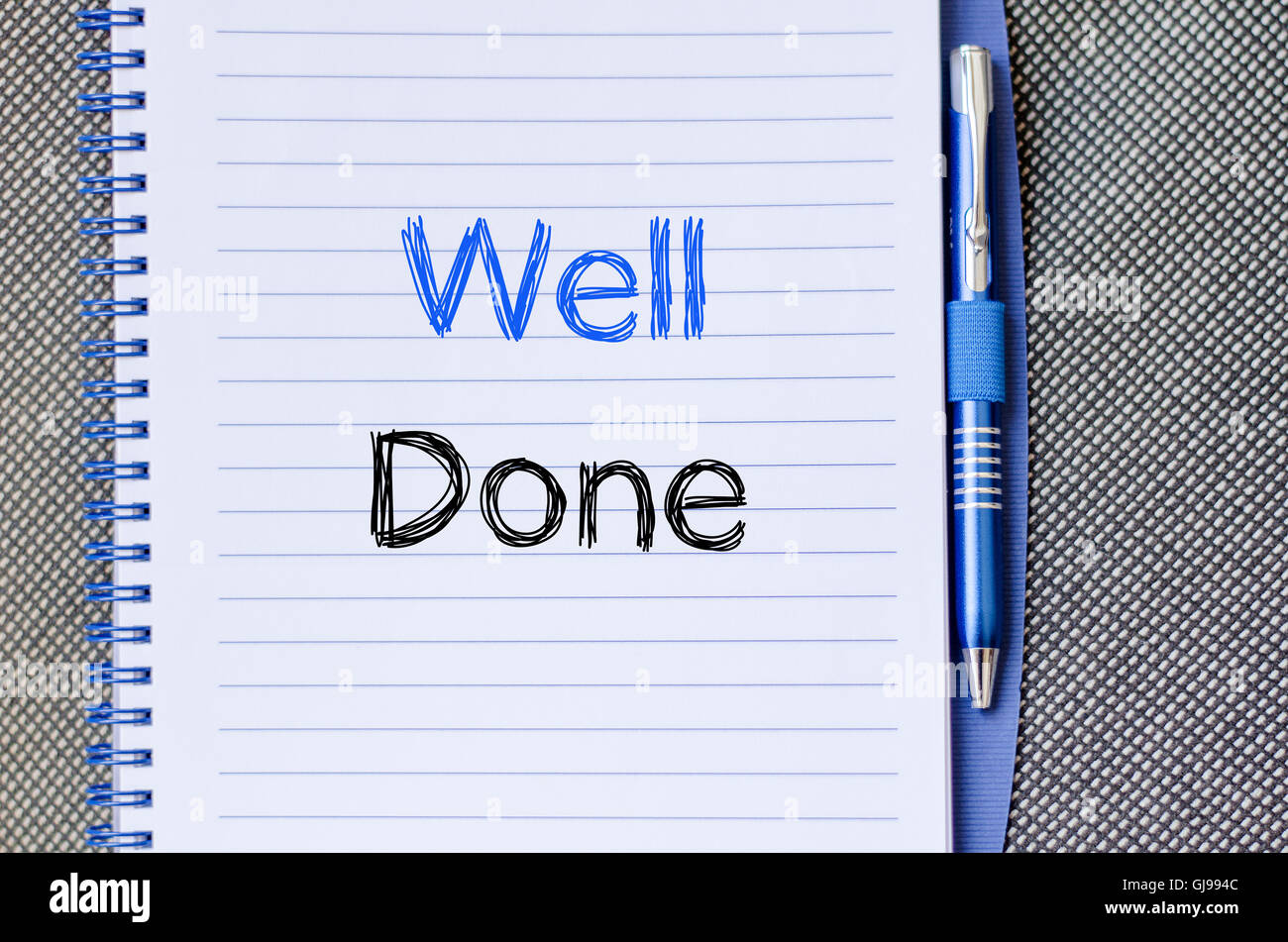 Well done text concept write on notebook Stock Photo