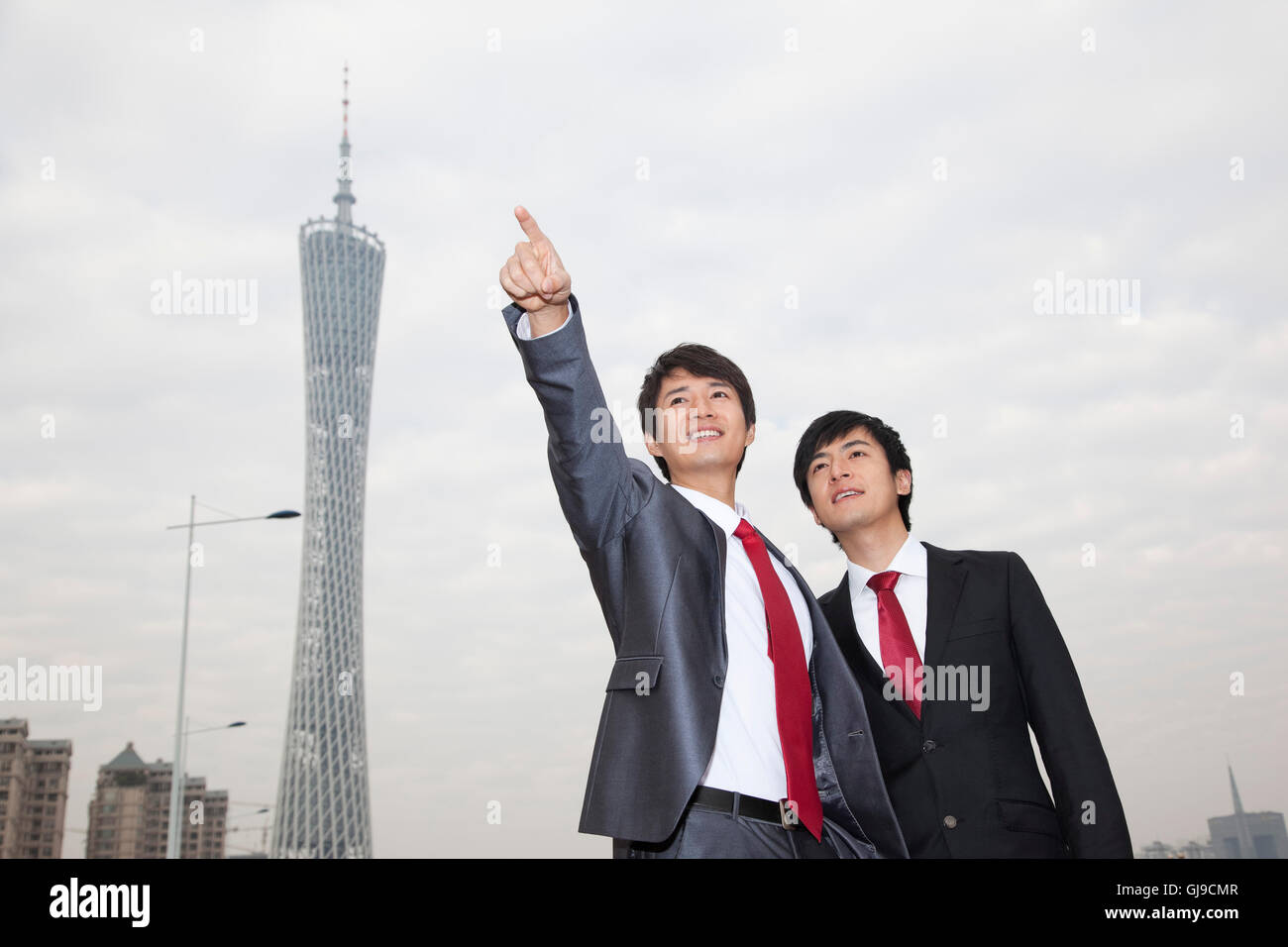 Young business man outside office building Stock Photo - Alamy