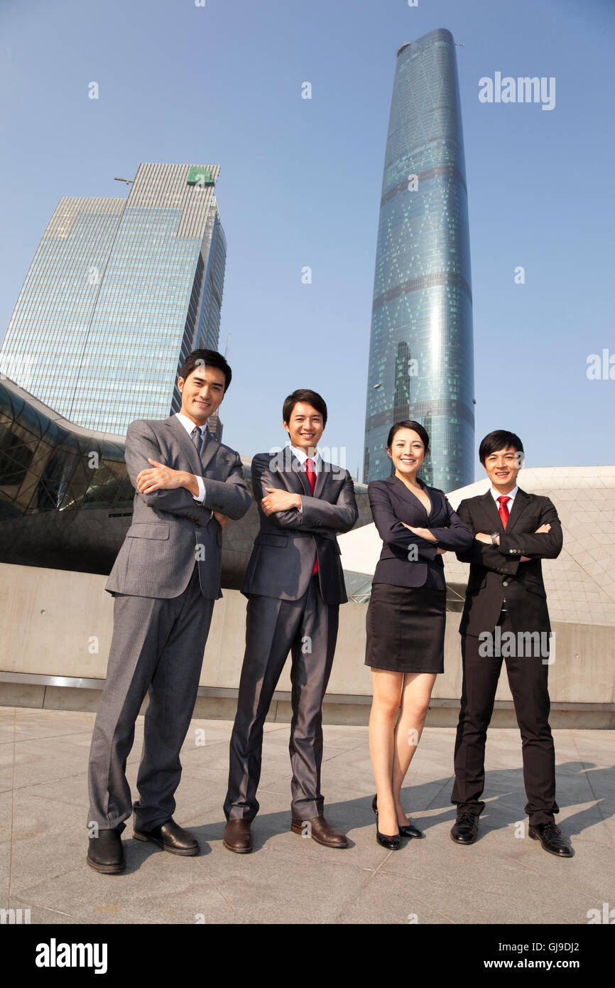 Young men and women in business outside the office building Stock Photo ...