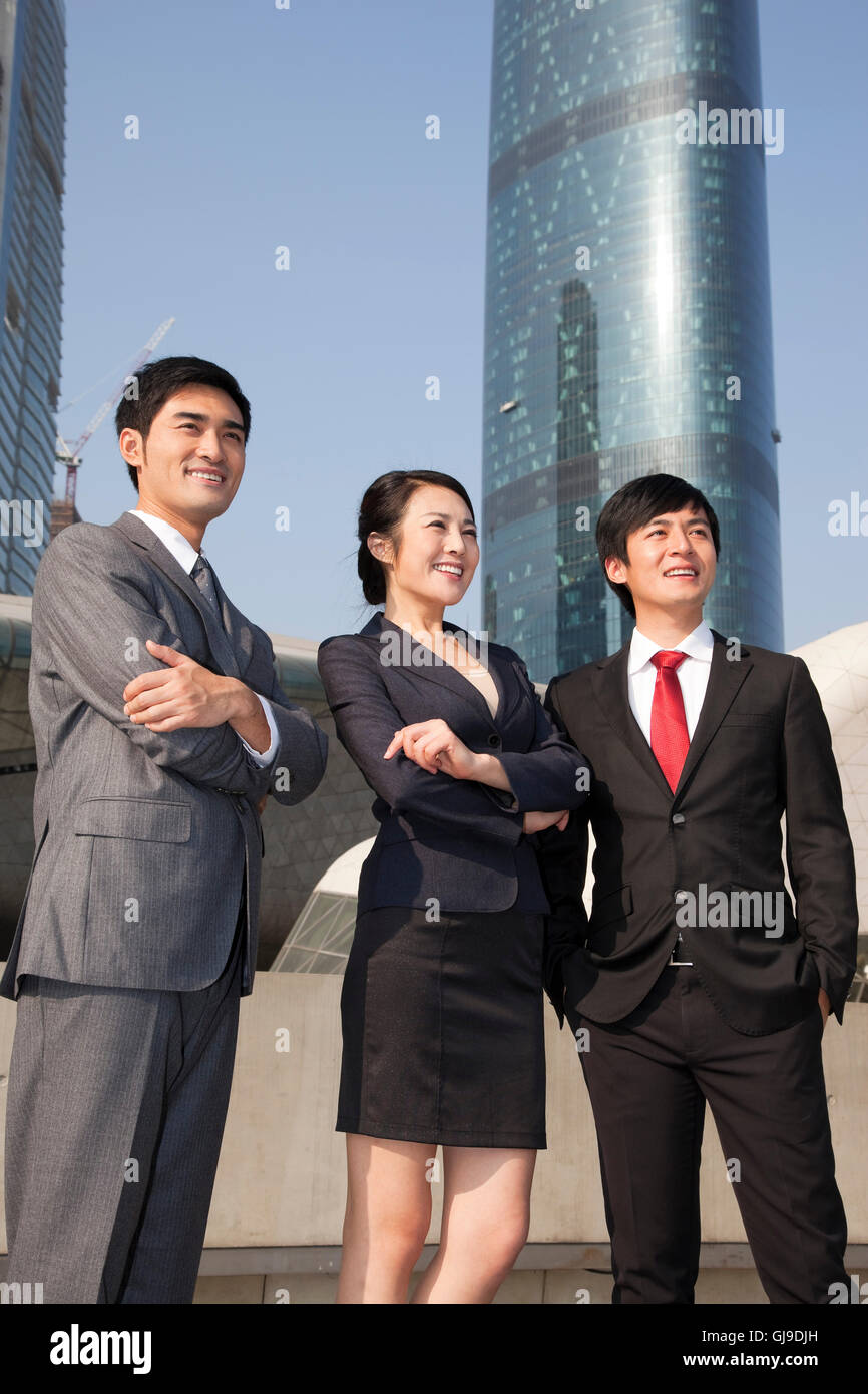 Young men and women in business outside the office building Stock Photo ...