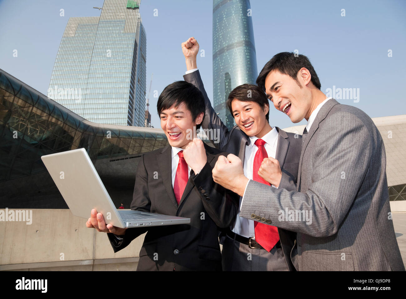Young business man outside office building Stock Photo - Alamy