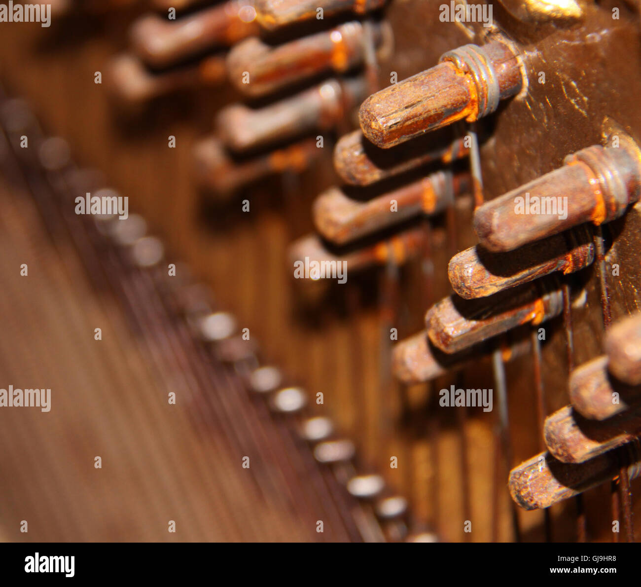 Inside of an Upright Piano tuning knobs and strings Stock Photo Alamy