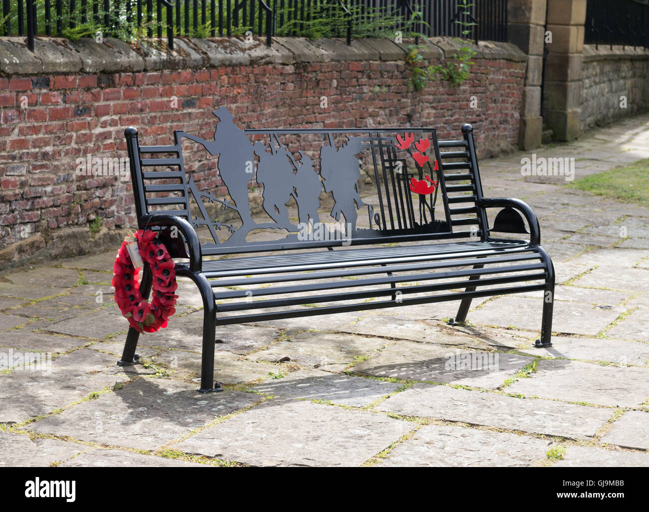 WW1 Memorial steel bench with poppy wreath, Gateshead, Tyne and Wear, England, UK Stock Photo