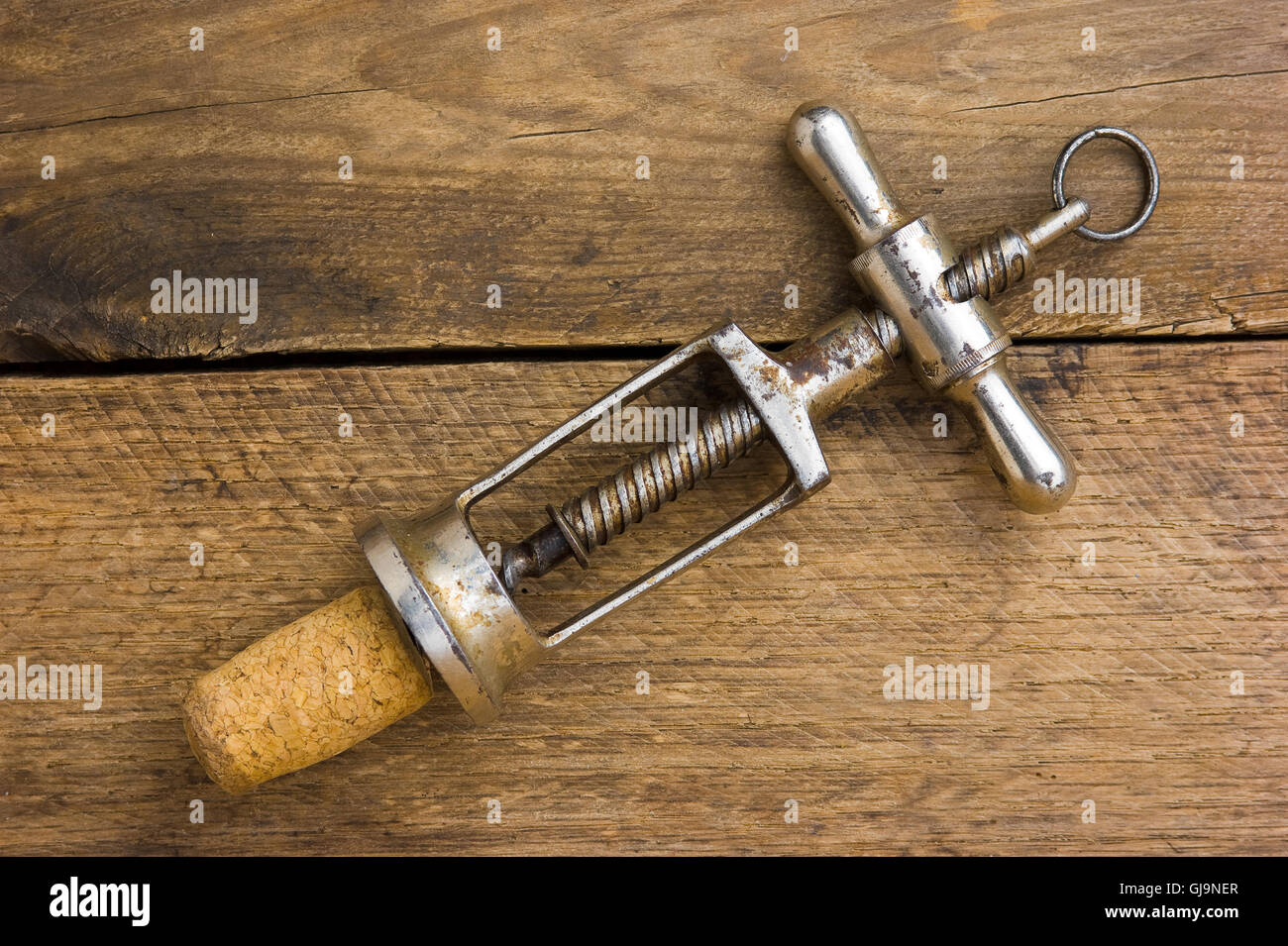 old corkscrew with a cork Stock Photo Alamy