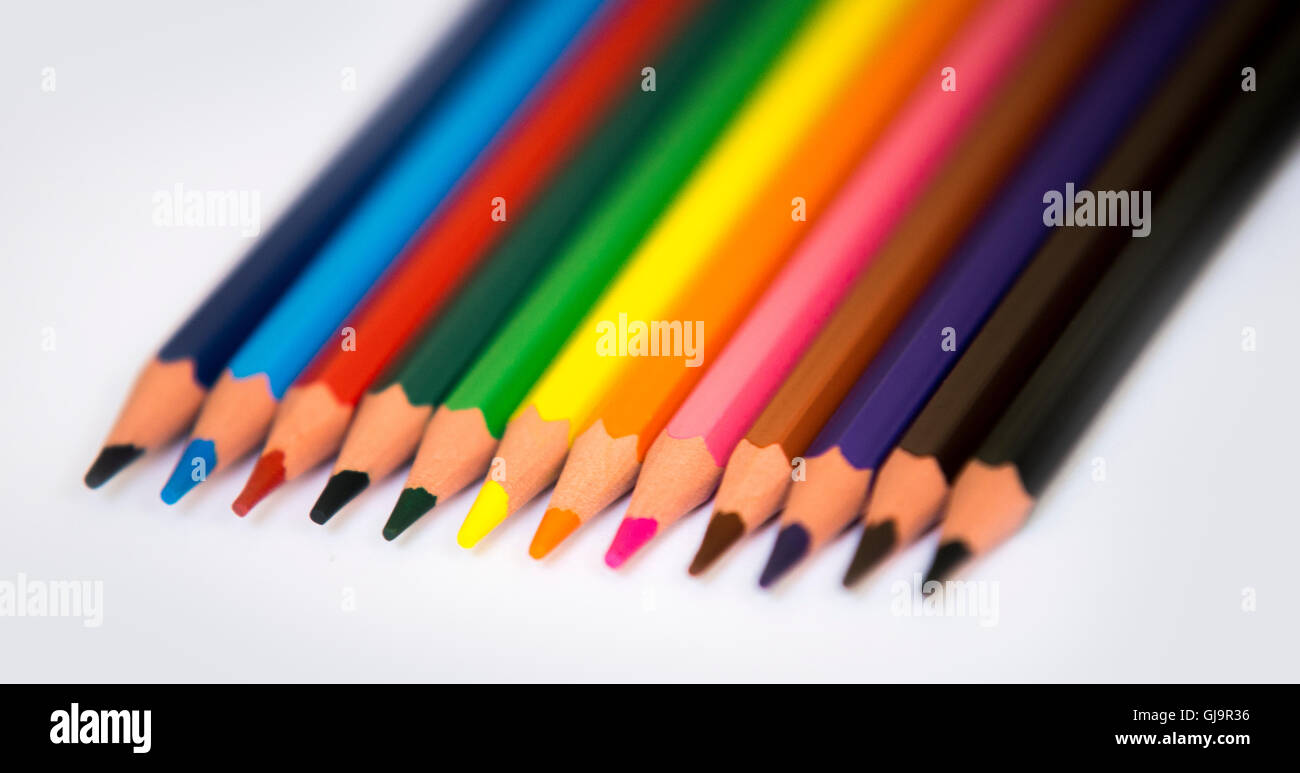 Colorful pencils isolated on a white paper background, selective focus Stock Photo