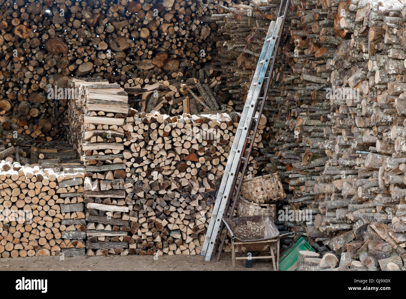 Intricate log pile in Tuscany, Italy Stock Photo