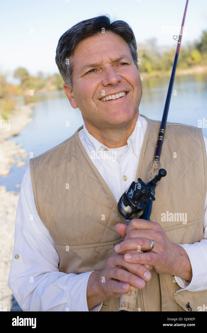 Man With Fishing Pole Stock Photo Alamy