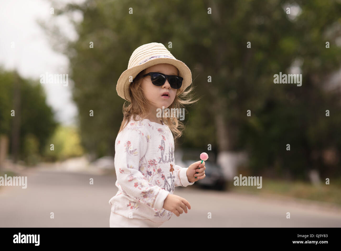 Portrait of stylish little girl in hat 