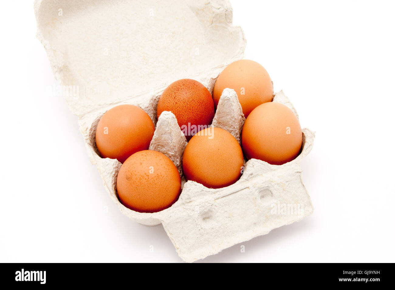 six brown organic eggs in a box Stock Photo