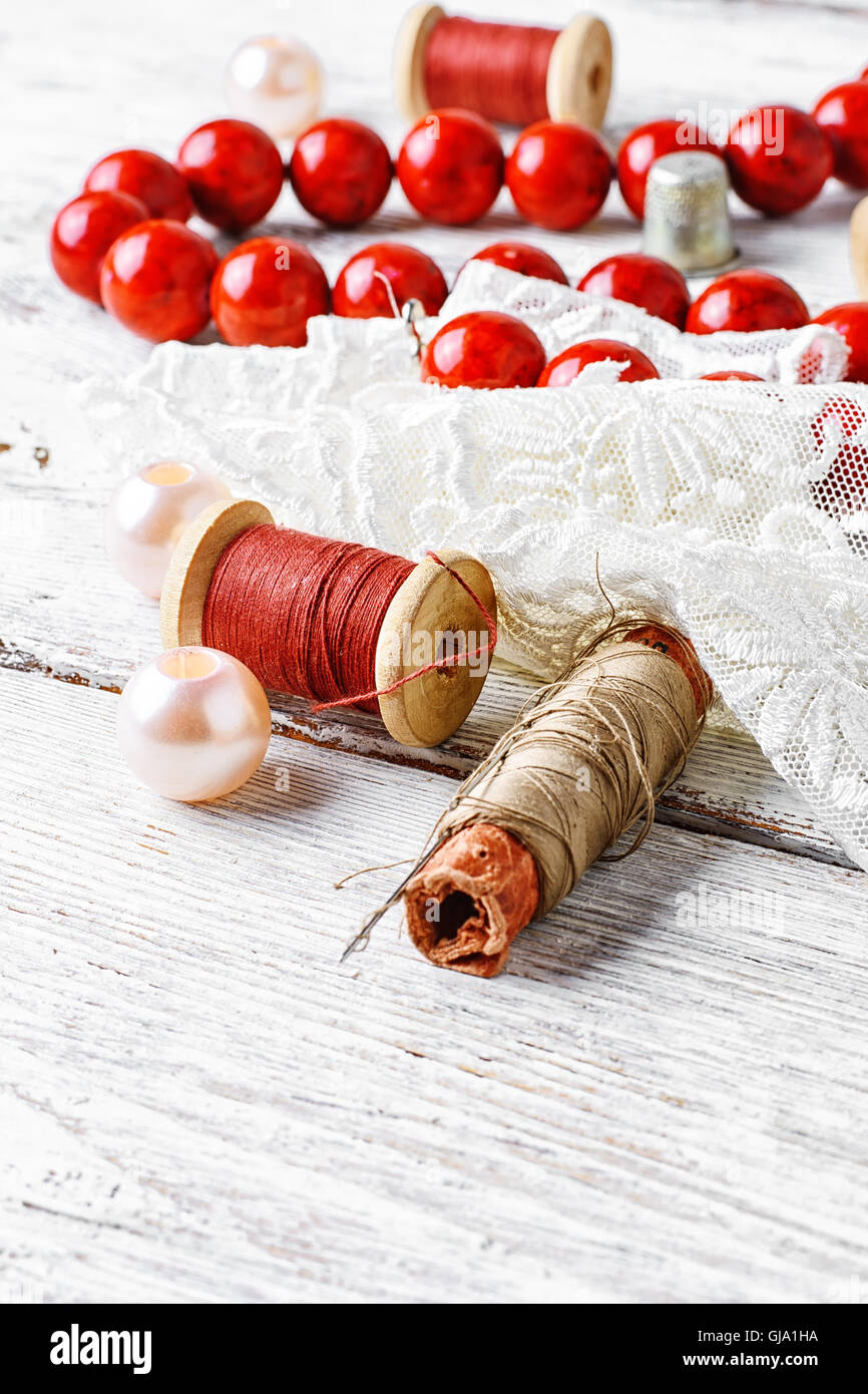 Bright red coral beads,lace and beads set of threads Stock Photo