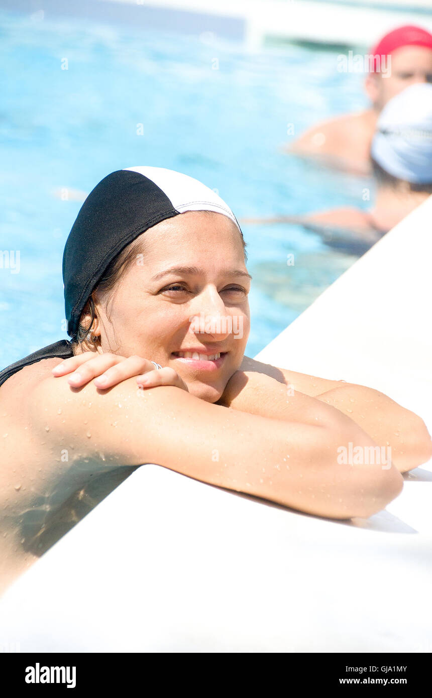 woman pool edge swimming cap Stock Photo Alamy
